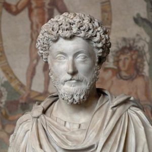 Marble bust of a Roman philosopher with curly hair and beard.